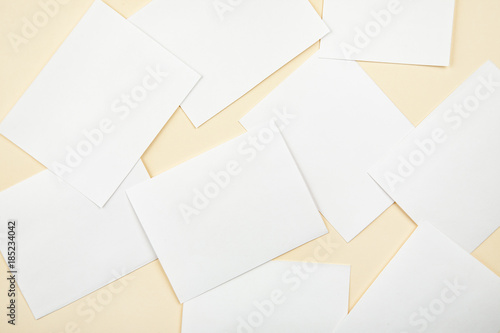 Blank white paper cards on a soft color background, business cards mockup
