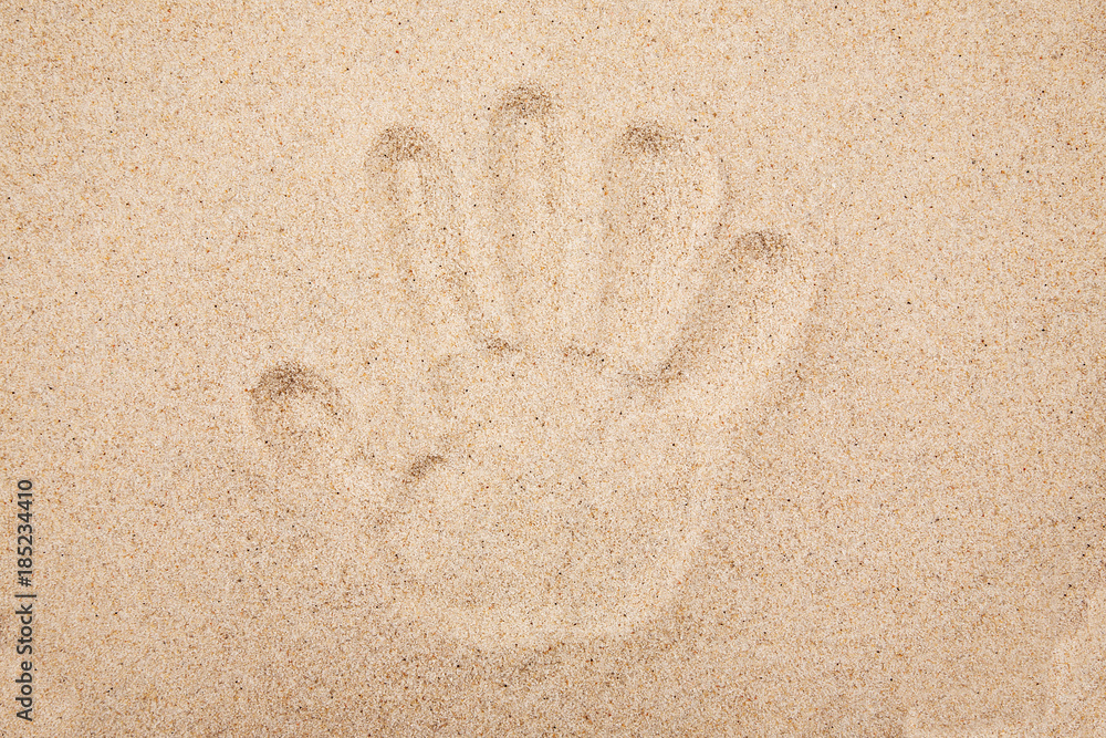 Imprint of the human hand in the sand Imprint of the human hand in the sand