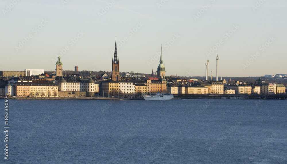 Stockholm waterfront at lake Malaren. Landmarks on Riddarholmen, The Knights' Islet,  and the old town, in midwinter pale sunlight