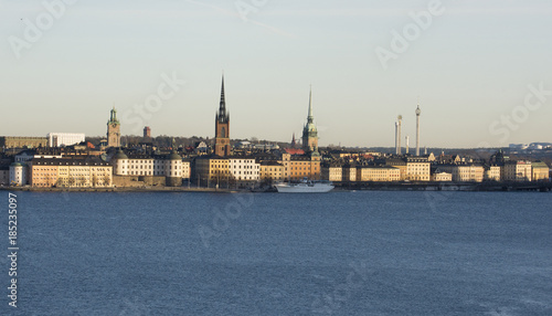 Stockholm waterfront at lake Malaren. Landmarks on Riddarholmen, The Knights' Islet, and the old town, in midwinter pale sunlight