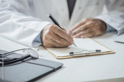 Physician Working at His Office