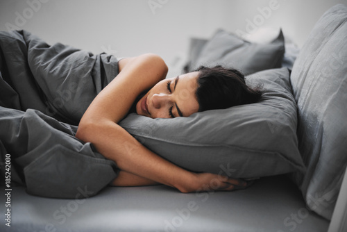 Billede på lærred GIrl lying down in bed and sleeping