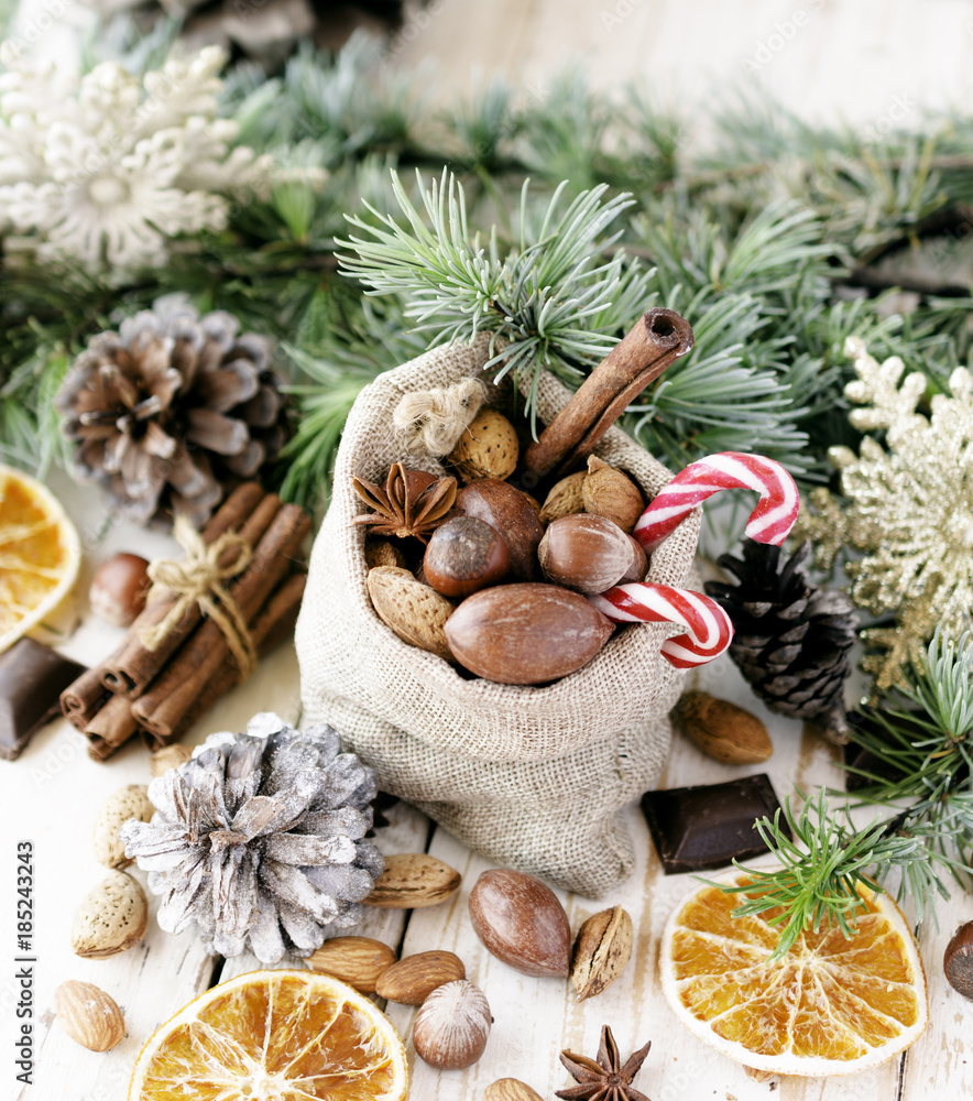 New Year or Christmas composition with walnuts, mulled wine wood background, selective focus New Year or Christmas composition with walnuts, mulled wine wood background, selective focus