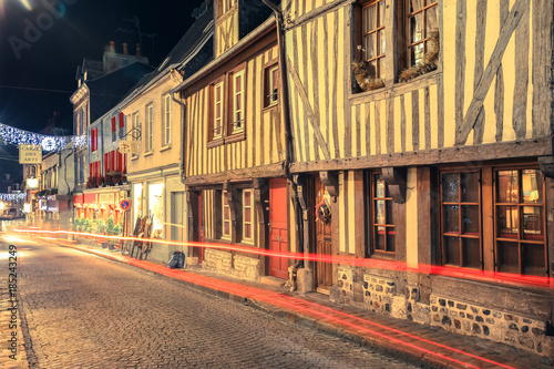 Street scene of houses of the old city centre with light trails in Honfleur  Normandy  France