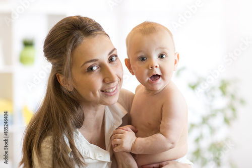 Portrait of happy mother an...