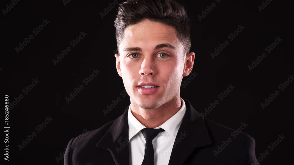 The looked down guy laughs and then looks at the camera with a serious look The looked down guy laughs and then looks at the camera with a serious look
