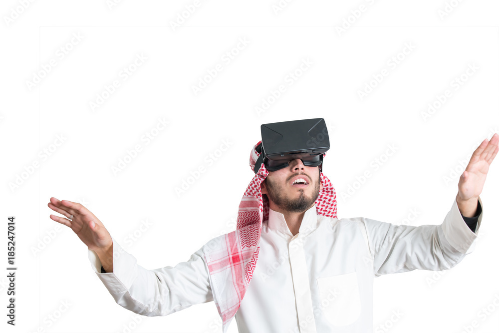 Young muslim guy trying VR glasses. Isolated. Young muslim guy trying VR glasses. Isolated.
