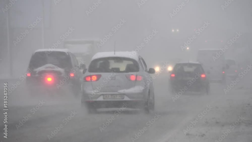 Blizzard on the Road and low visibility. Bad weather in the city 4k. Blizzard on the Road and low visibility. Bad weather in the city 4k.