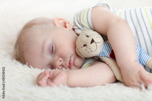 Cute baby boy sleeping with...