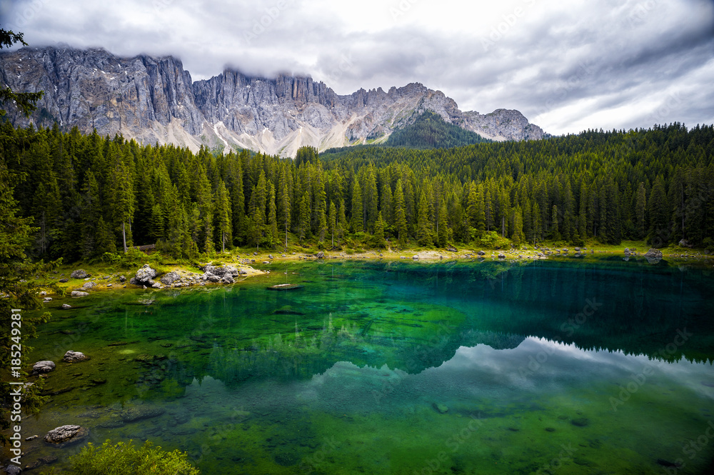 Lake Carezza is a small alpine lake located in the upper Val d'Ega at 1.534. Trentino Alto Adige. Italy