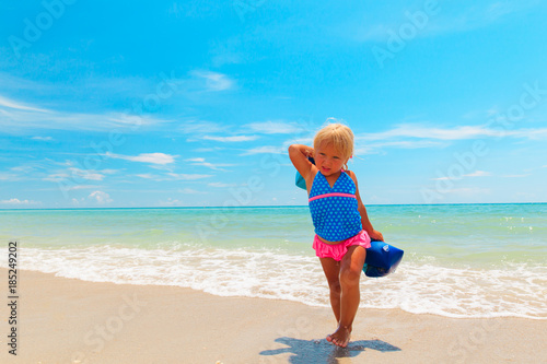 little girl go swim at beach