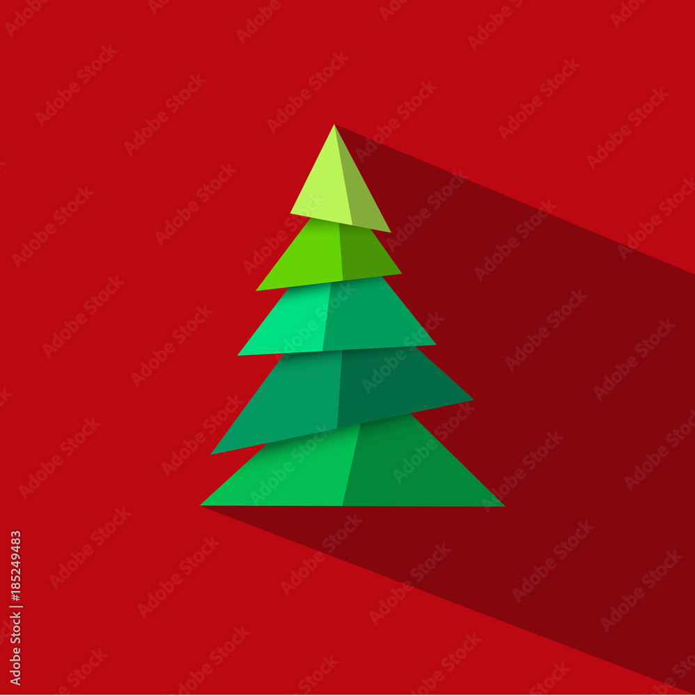 Green Christmas tree made paper pieces with long shadow on red