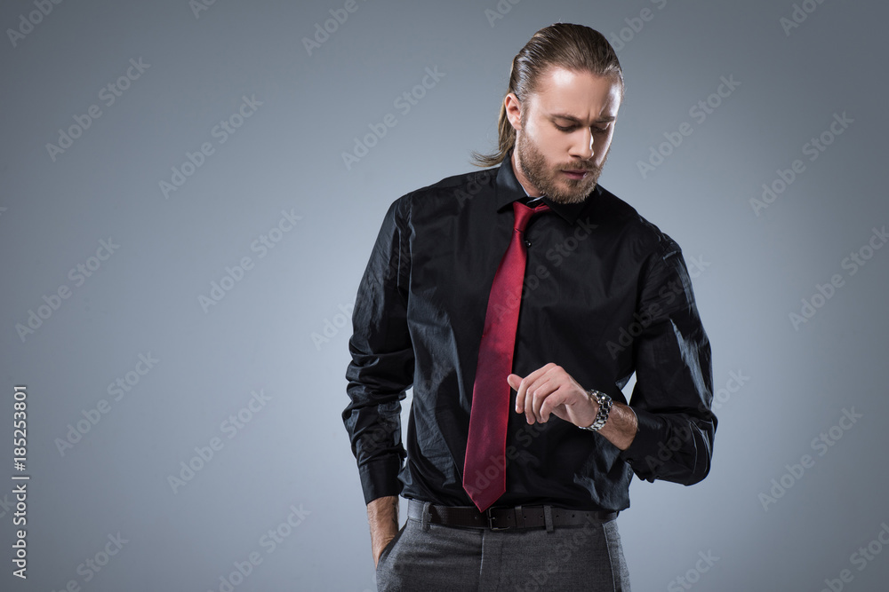 Dressing in a light blue shirt a pattern tie gray pants wearing glasses  a black college student is standing by a pattern wall with a window confi  Stock Photo  Alamy