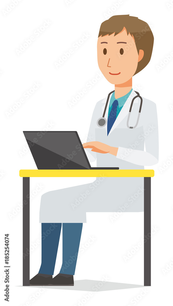 A young male doctor wearing a white coat is operating a laptop computer