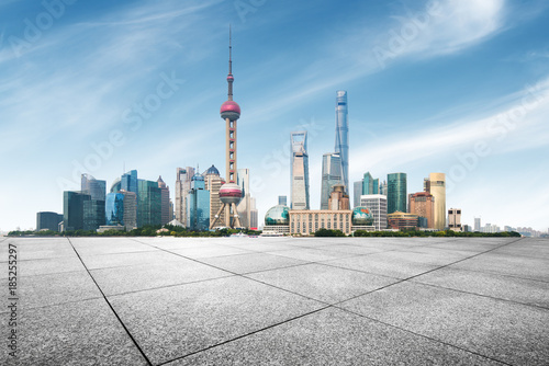 clean asphalt road with city skyline background,shanghai,china. photo