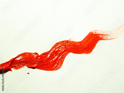 Wavy line, painted with thick red acrylic paint.