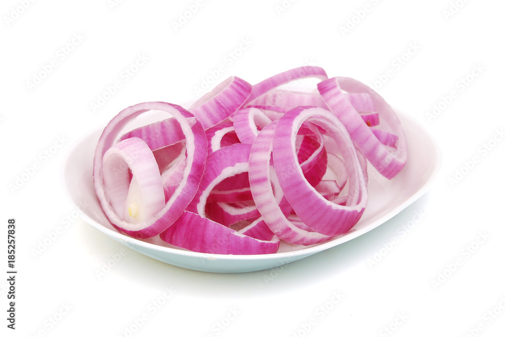 Sliced red onion in plate on white background Sliced red onion in plate on white background