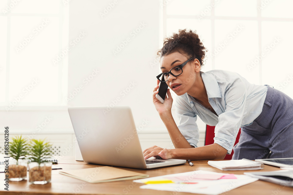 Business woman with mobile phone and using laptop Business woman with mobile phone and using laptop