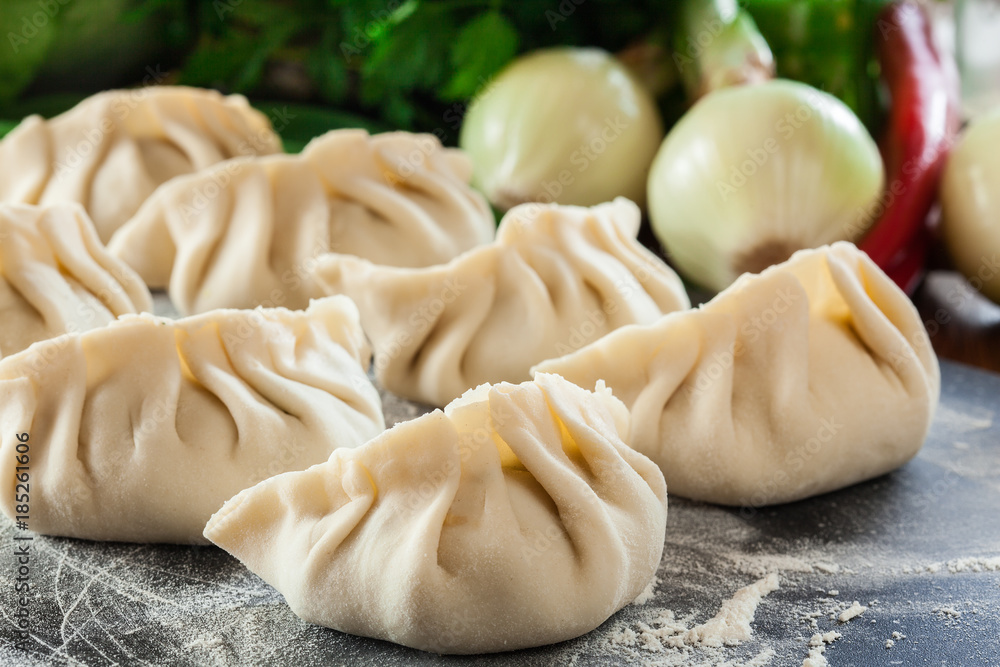Raw gyoza or jiaozi dumplings ready for cooking Raw gyoza or jiaozi dumplings ready for cooking