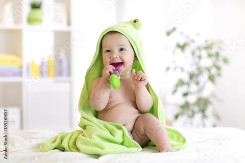 Little baby in green towel ...