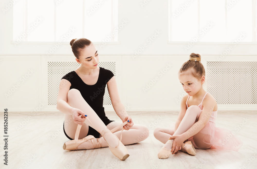 Little girl learn ballet with teacher copy space Little girl learn ballet with teacher copy space