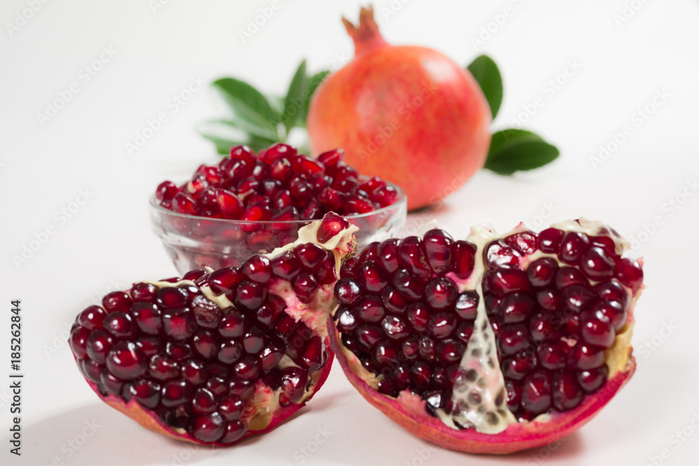 Pieces of pomegranate on a white background Pieces of pomegranate on a white background