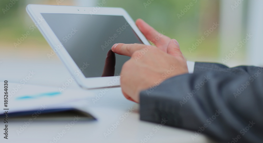Fototapeta premium man holding digital tablet, closeup