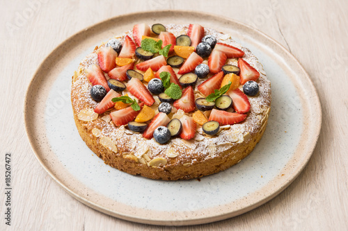 Sweet bright cakes with fruit and berries