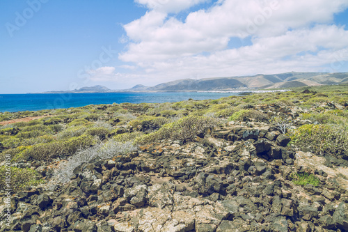 Lanzerote beach with blue atlantic ocean. photo