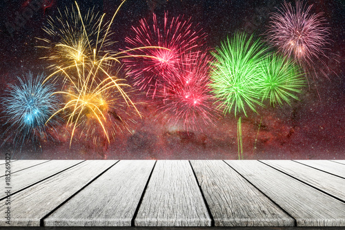 Wood top on gold bokeh with fireworks abstract background.