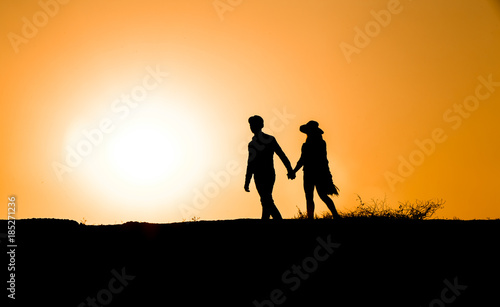 twp lovers silhouette at sunset