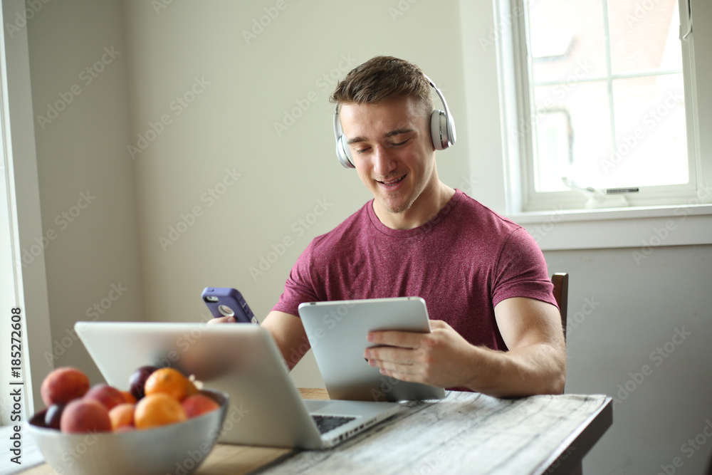 Young man using technology. Young man using technology.