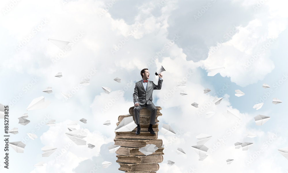 Businessman announcing something in loudspeaker and paper planes fly around Businessman announcing something in loudspeaker and paper planes fly around