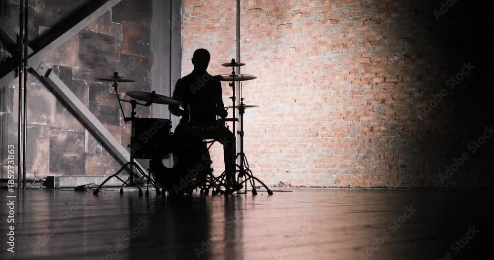 silhouette of drummer man to play the drums