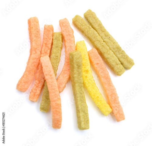фотографія Naturally Baked Veggie Straws Made From Tomatoes, Spinach and Potatoes on white