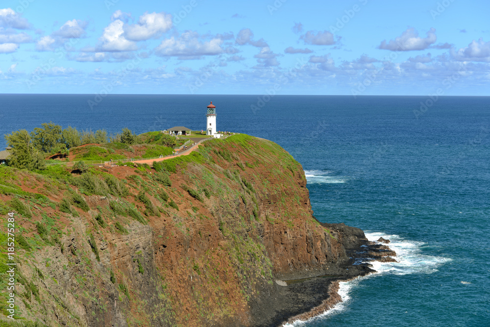 White Lighthouse and Blue Sea - Kilauea Lighthouse against blue ocean and blue sky, Kauai, Hawaii, USA