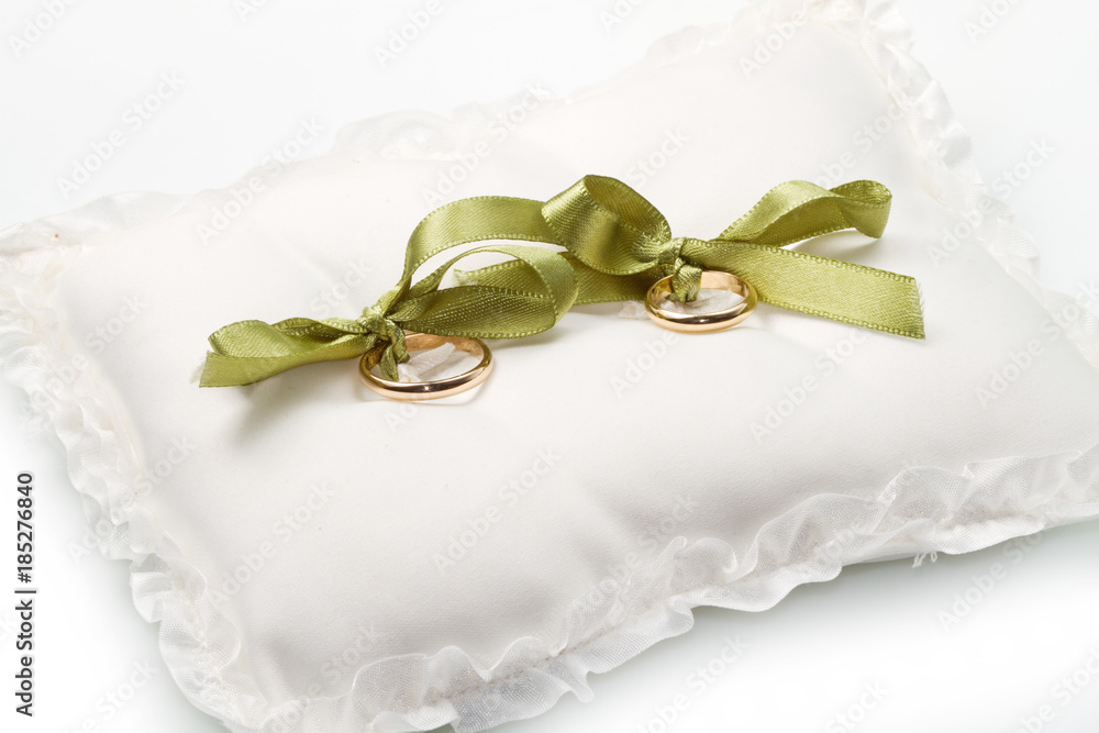 gold wedding rings on white pillow gold wedding rings on white pillow