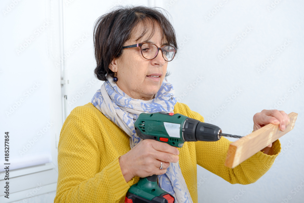 Woman doing DIY work at home Woman doing DIY work at home