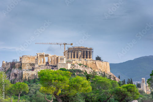 Acropolis with Parthenon. View from the ancient market  agora  with ruins of the famous classical Greek civilization  Athens  Greece.