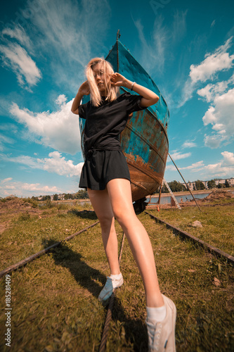 Girl in front of a ship