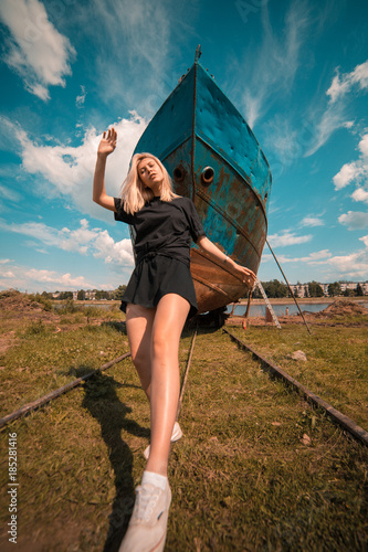 Girl in front of a ship