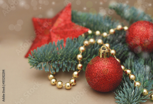 Christmas decorated composition with fir branches  tree red globes  Xmas greeting card. golden Beads with Copy Space for Text.