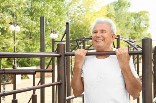 Mature man training outdoors