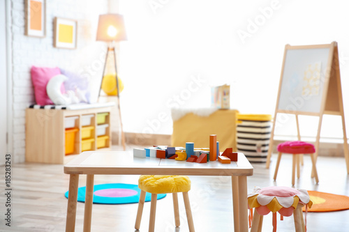 Child's room interior with colorful blocks on table