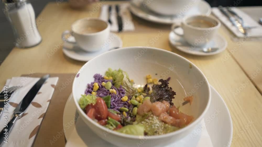 Man eating fresh healthy salad in cafe, point of view
Man eating fresh healthy salad in cafe, point of view