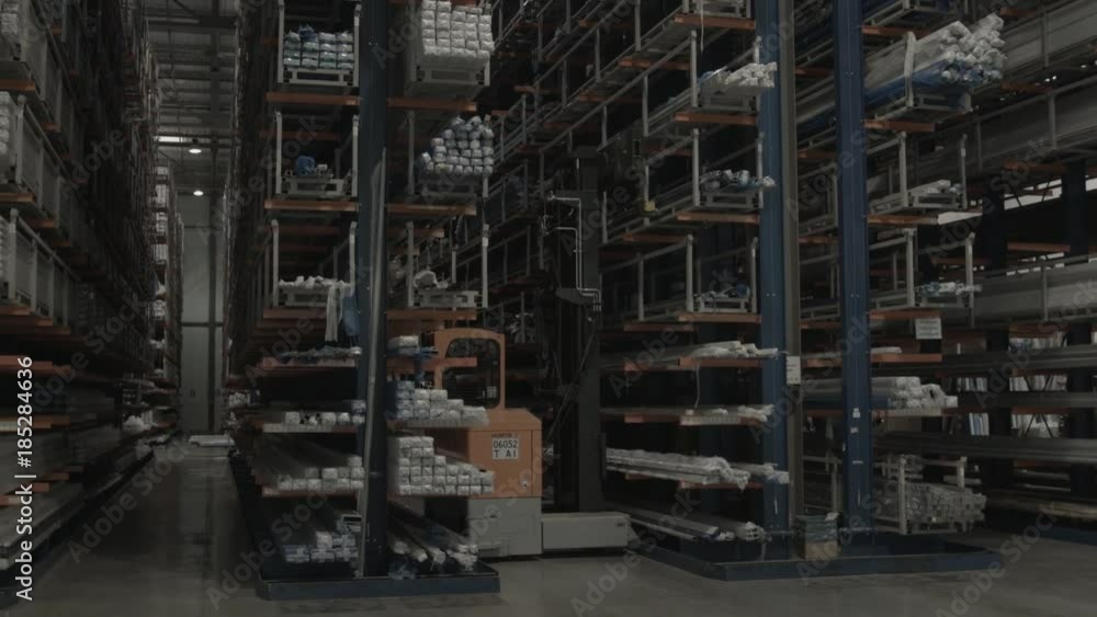 Forklift Truck Driver unloading Pallet In Storage Warehouse Forklift Truck Driver unloading Pallet In Storage Warehouse