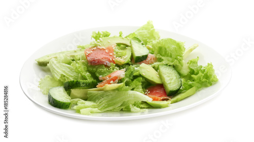 Plate with delicious vegetable salad on white background