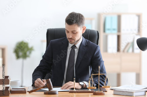 Young male notary working i...