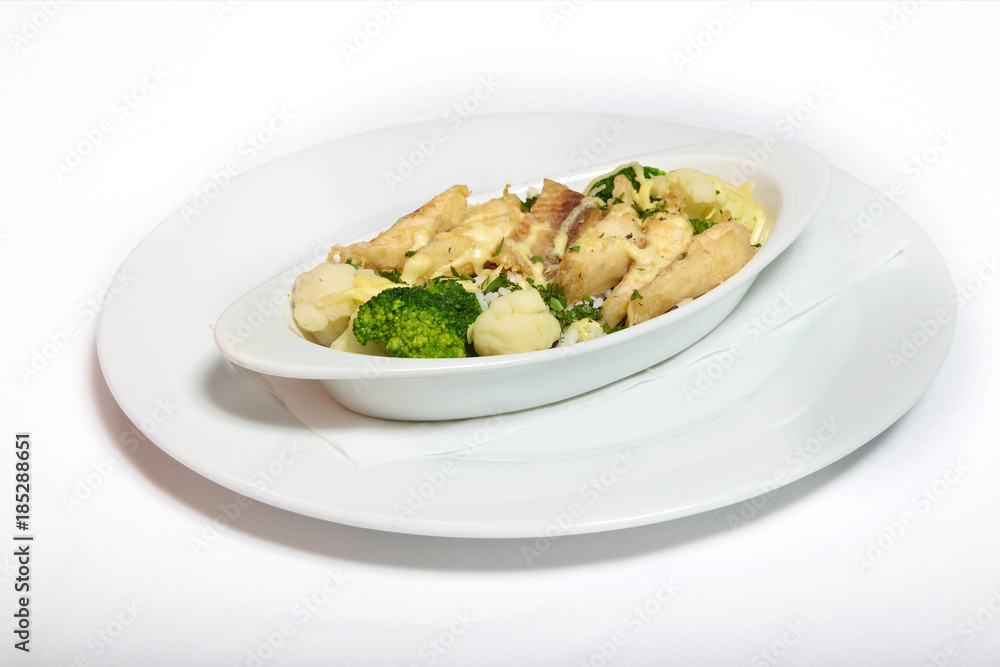 A plate of fish with vegetables A plate of fish with vegetables