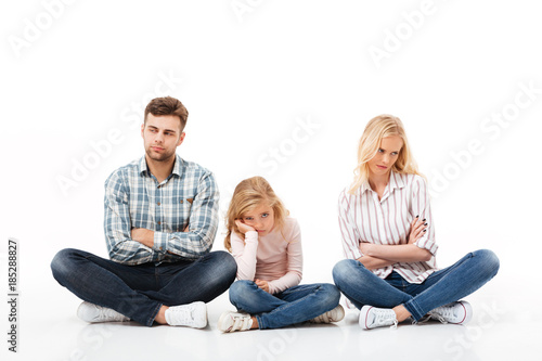 Portrait of an upset family sitting together